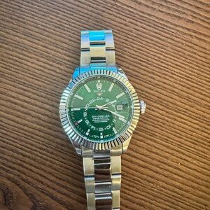 Rolex with Green Dial and Silver Bracelet Inauthentic